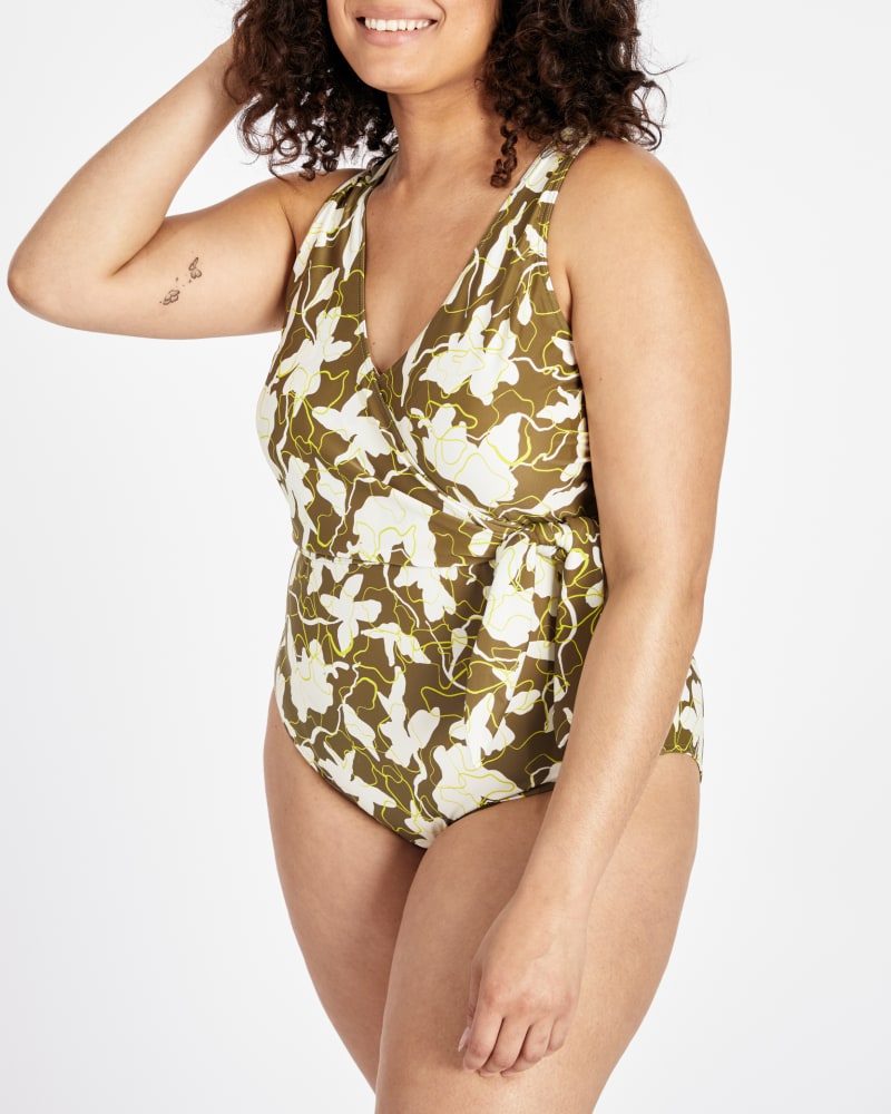 Front of a model wearing a size 2X Kelly Wrap One-Piece in MOSS/KIWI MULTI by Tanya Taylor. | dia_product_style_image_id:294590